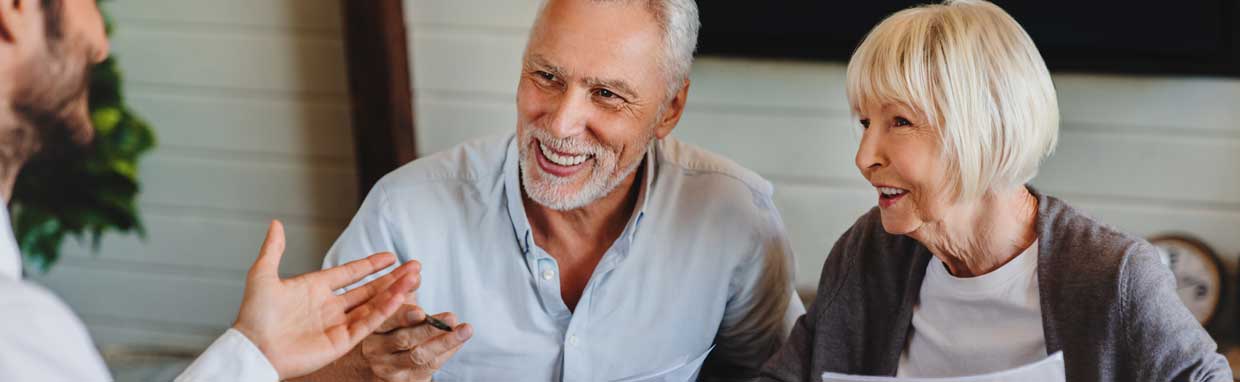 older cauple disucssing their future with an advisor
